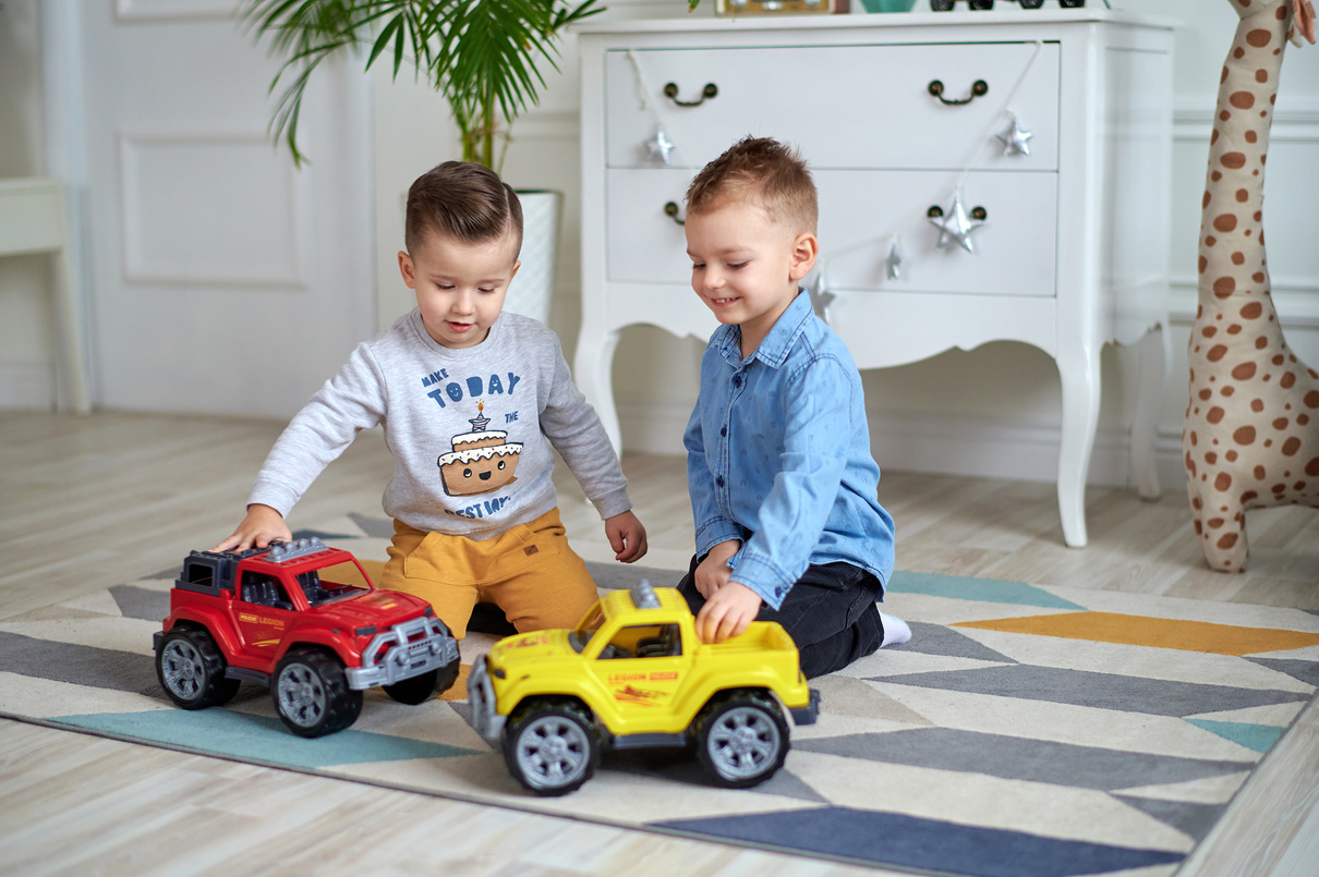 Two Boys Playing Toy Cars